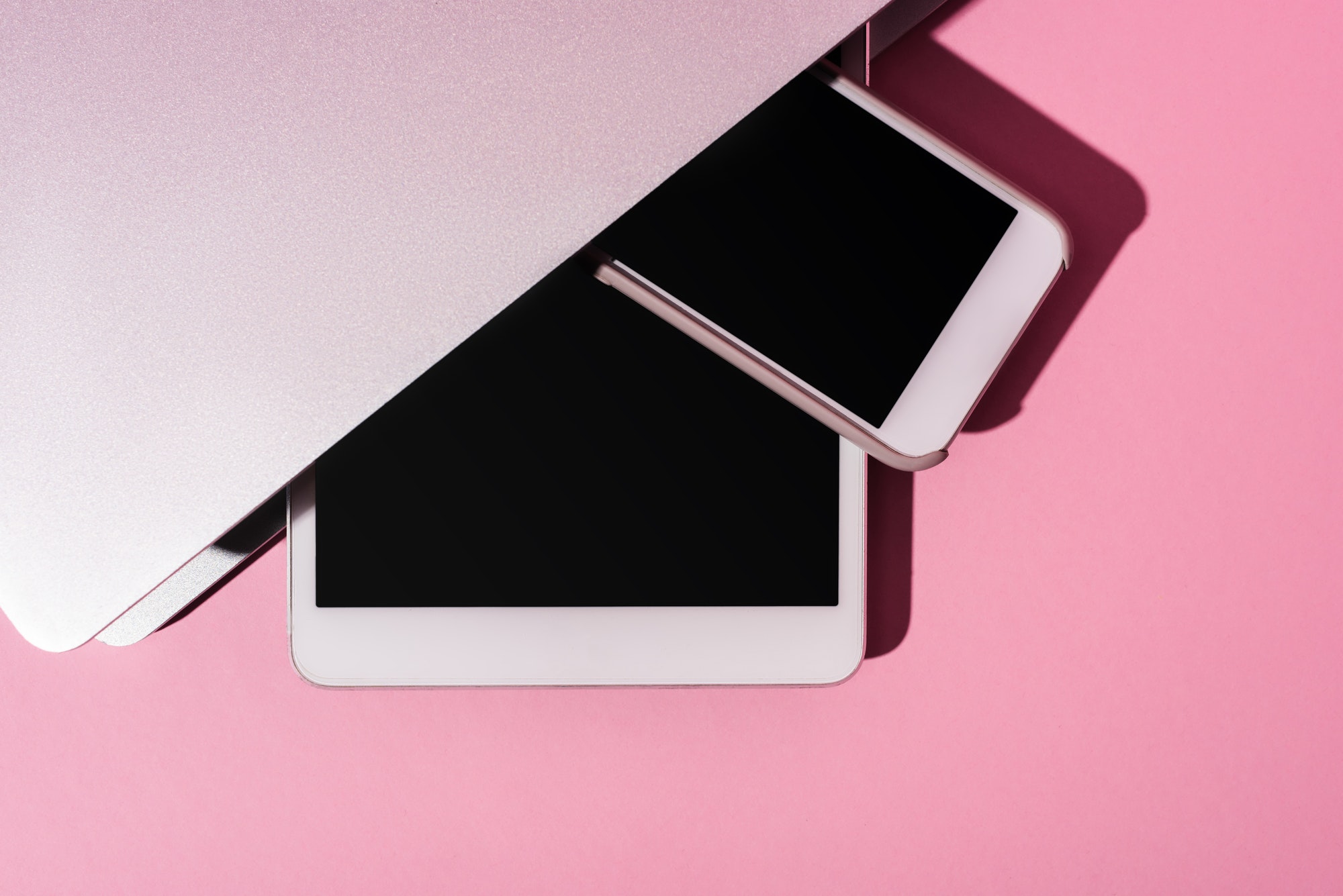 Top View of Gadgets on Pink Background
