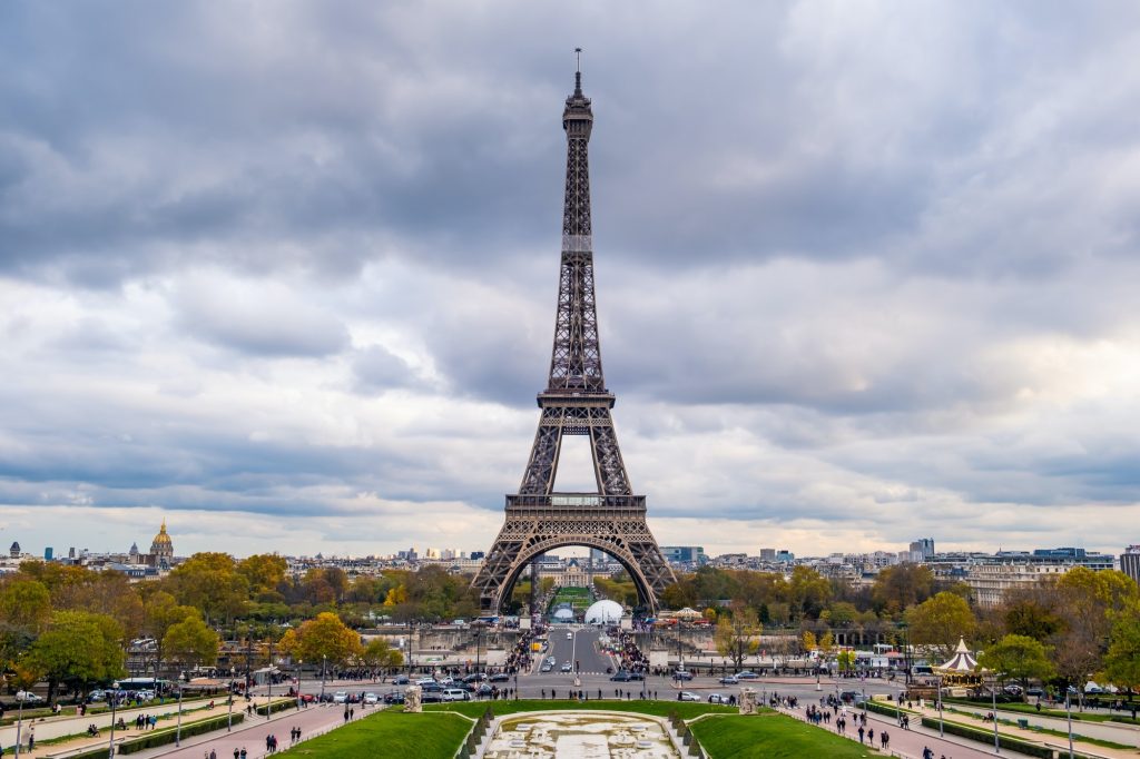 Beautiful landmark Eiffel tower in cloudy sky day in afternoon downtown in city of Paris, France.